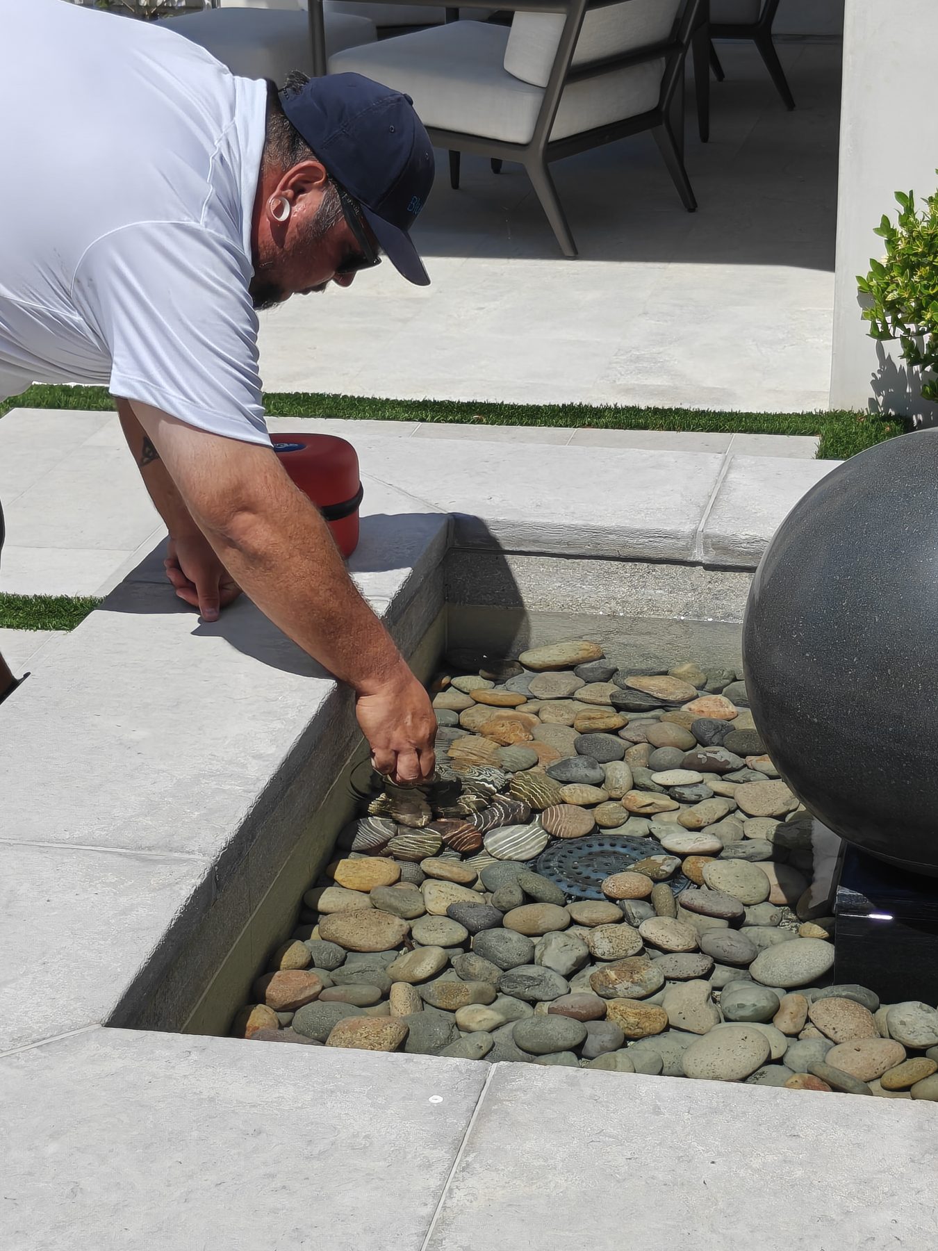 BlueLux technician sampling the courtyard orb fountain